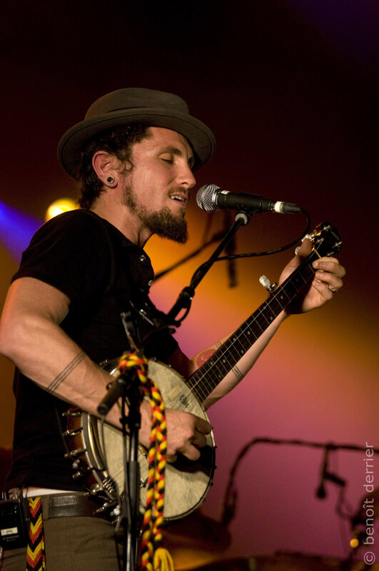 Musician playing banjo on stage