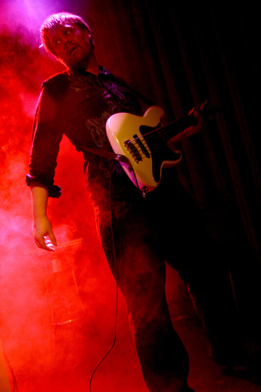 Musician playing bass guitar