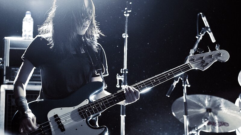 musician playing bass guitar