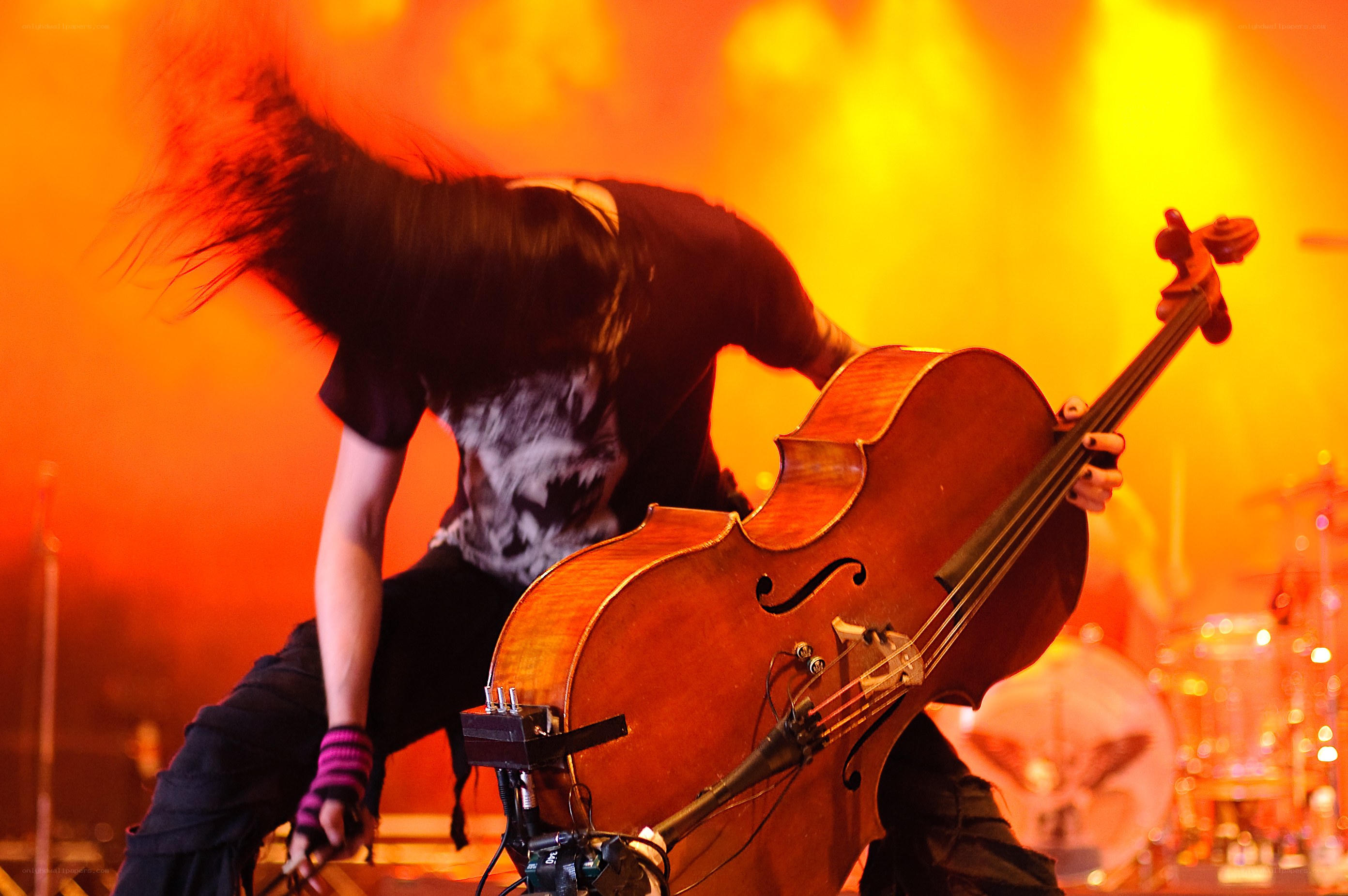 Musician playing cello on stage