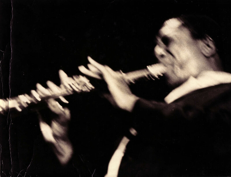 Musician playing flute in motion