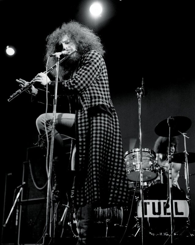 Musician playing flute on stage