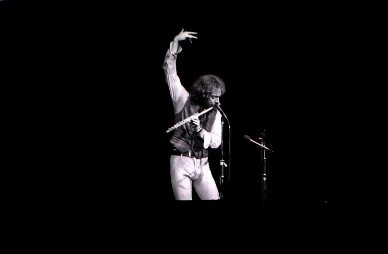 Musician playing flute on stage