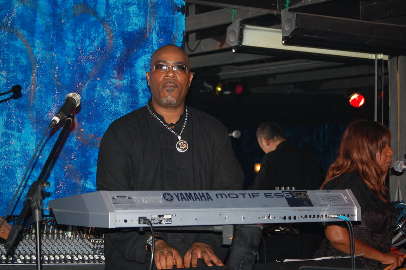 Musician playing keyboard on stage