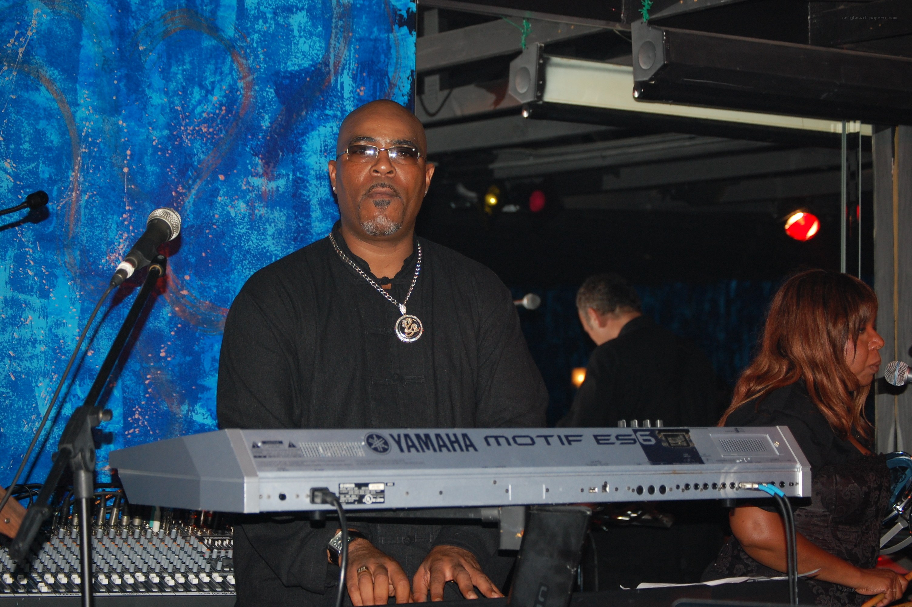Musician playing keyboard on stage