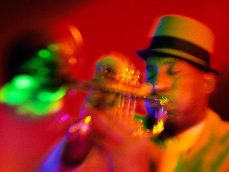 Musician playing trumpet on stage