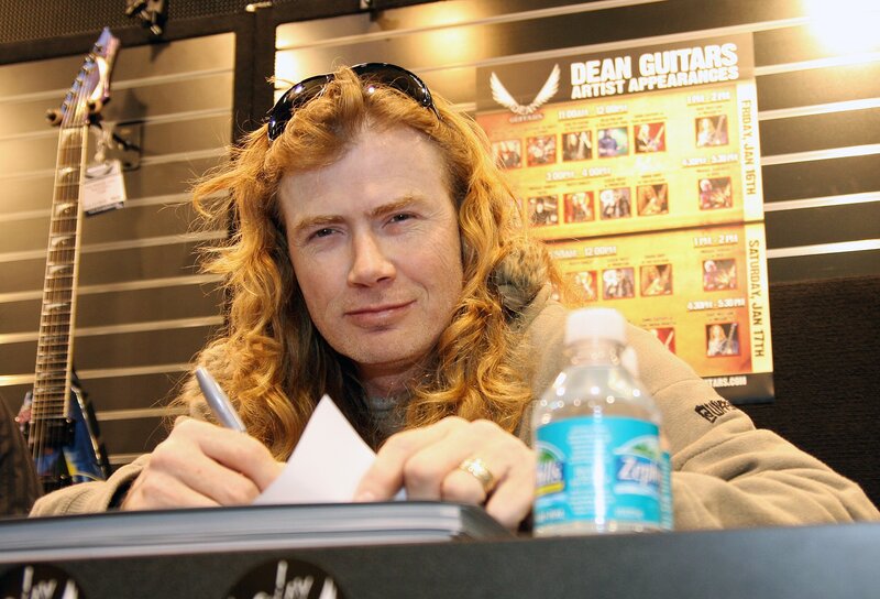 Musician signing autographs
