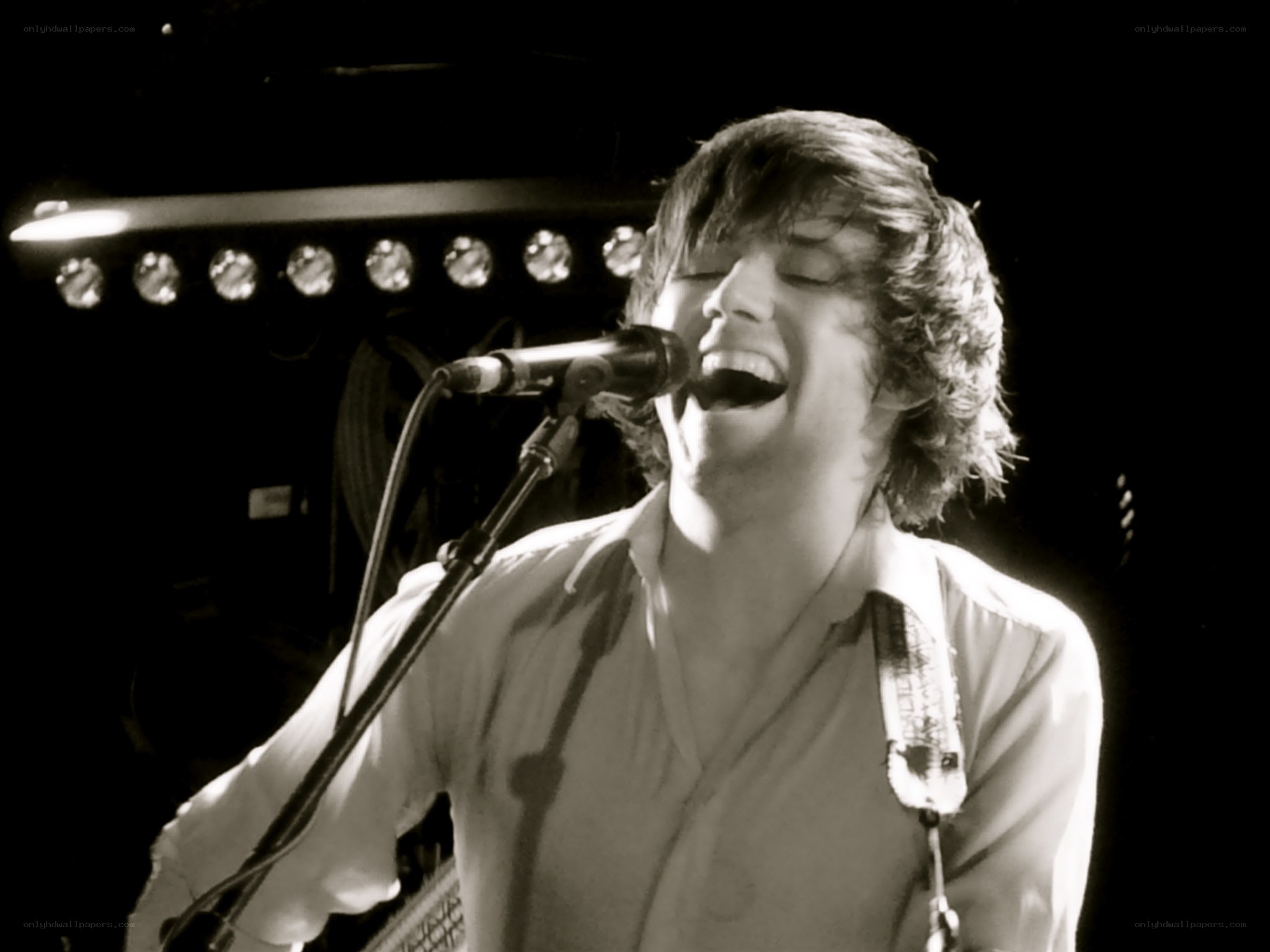 musician singing on stage