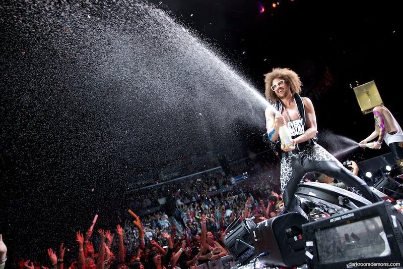Musician spraying champagne at concert