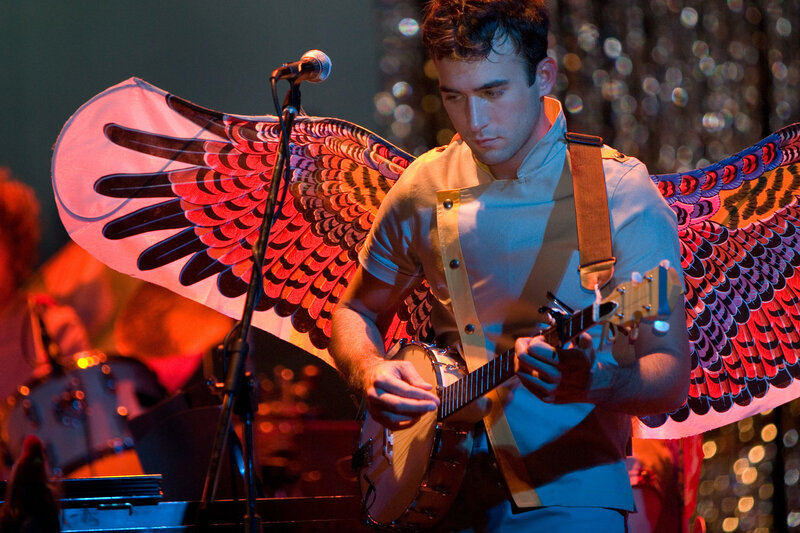 Musician with angel wings playing banjo