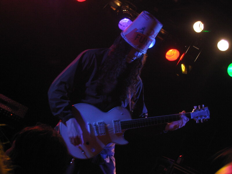 Musician with bucket hat on stage
