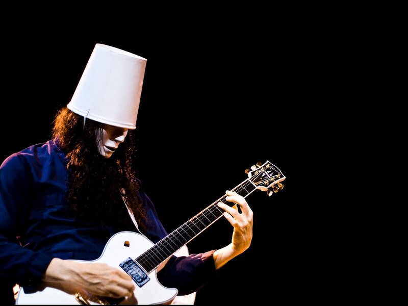 musician with bucket on head