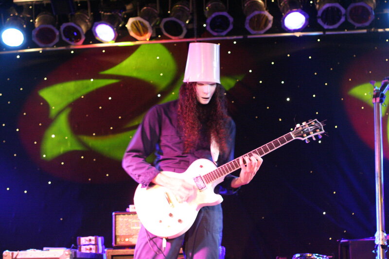 Musician with bucket on head