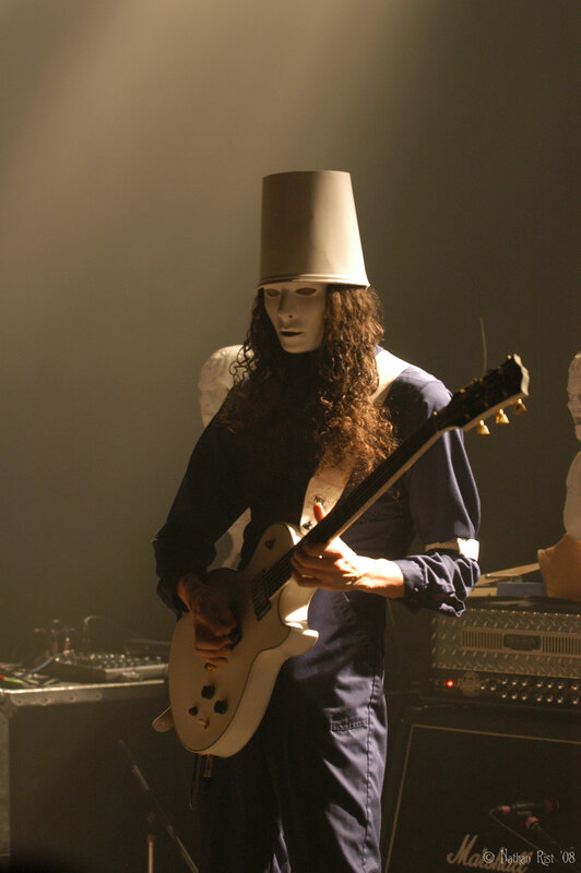 Musician with bucket on head