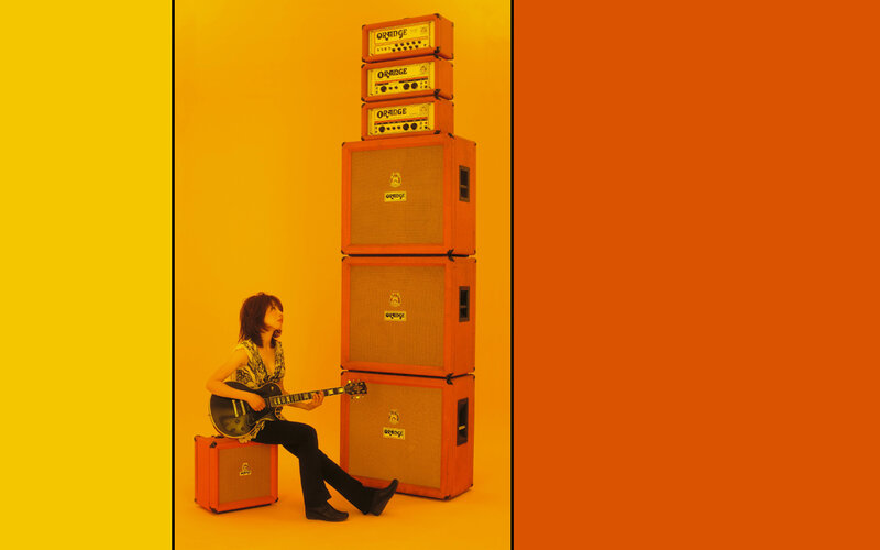 musician with guitar and amplifiers