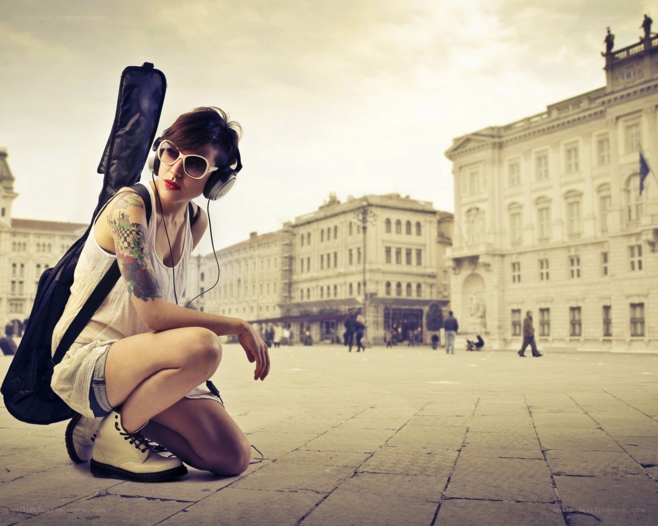 Musician with guitar case