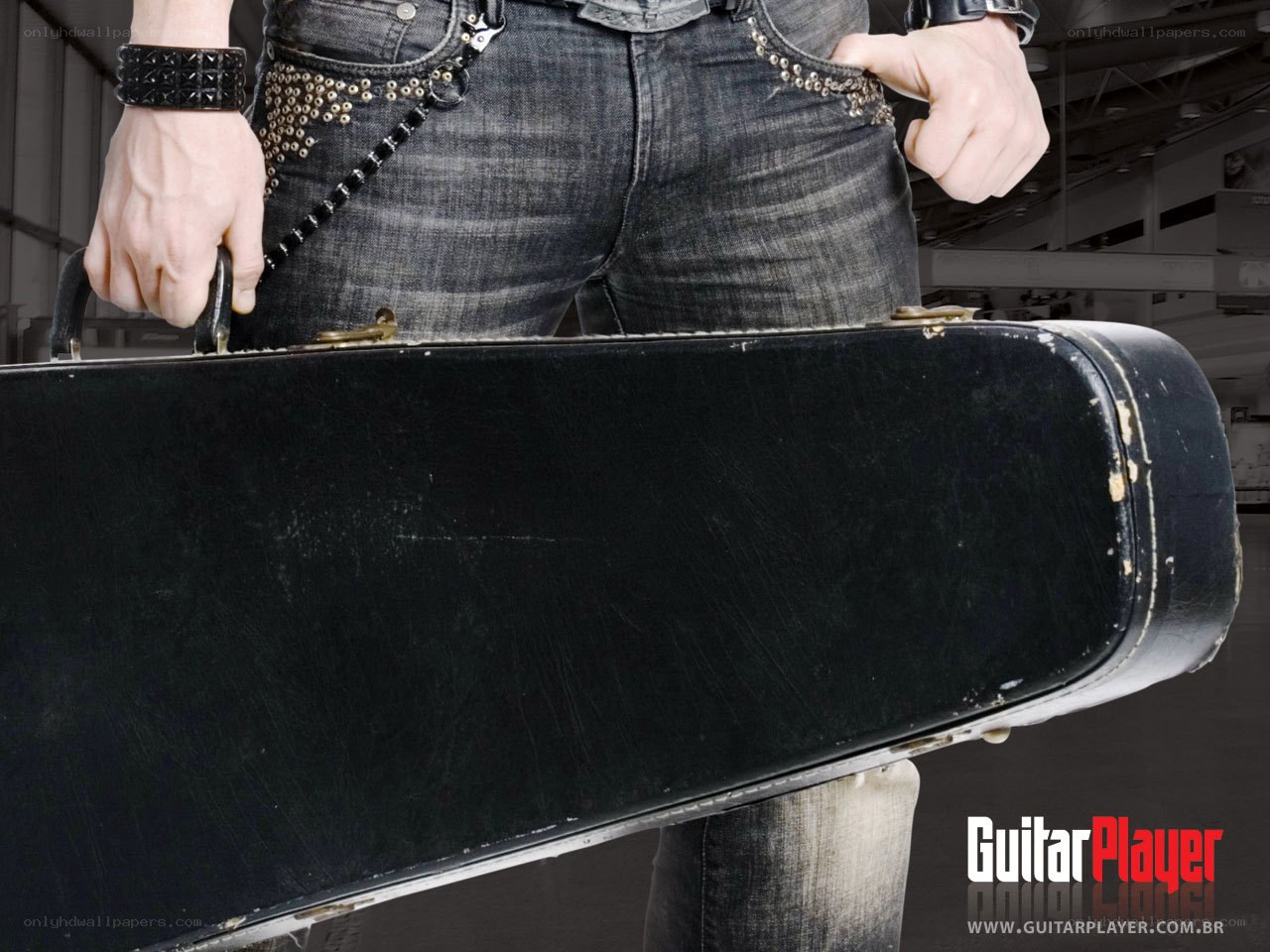 musician with guitar case