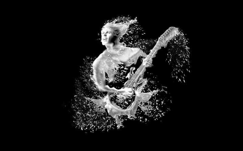 musician with guitar in milk splash