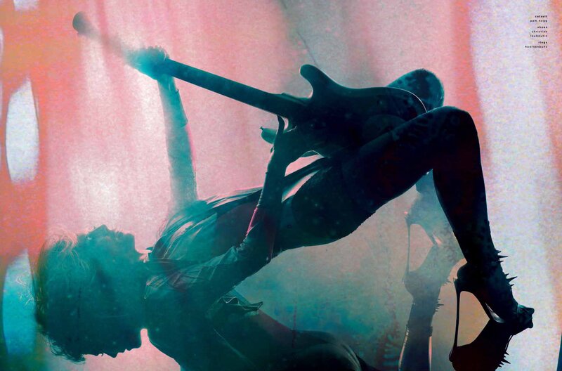 Musician with guitar in silhouette