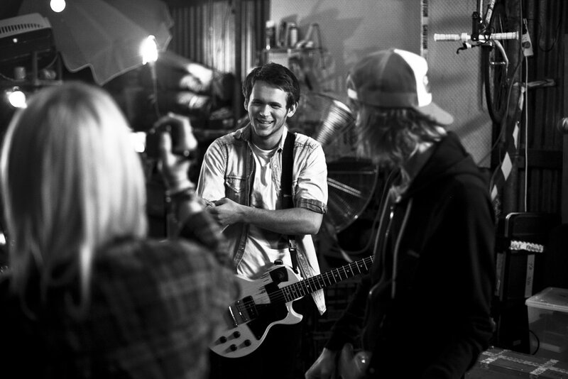 Musician with guitar in studio