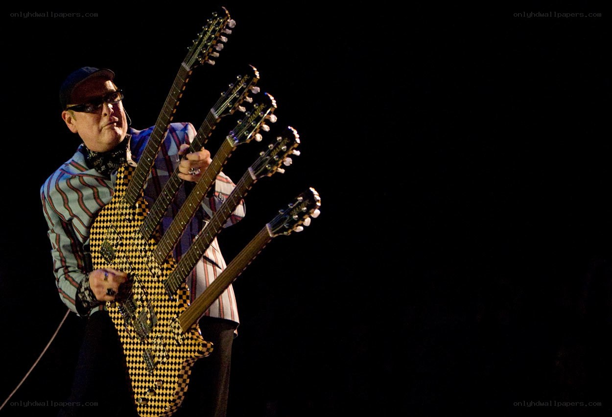 Musician with multi-neck guitar
