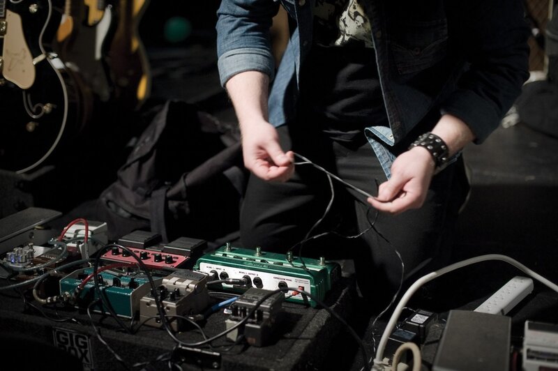musician with pedalboard