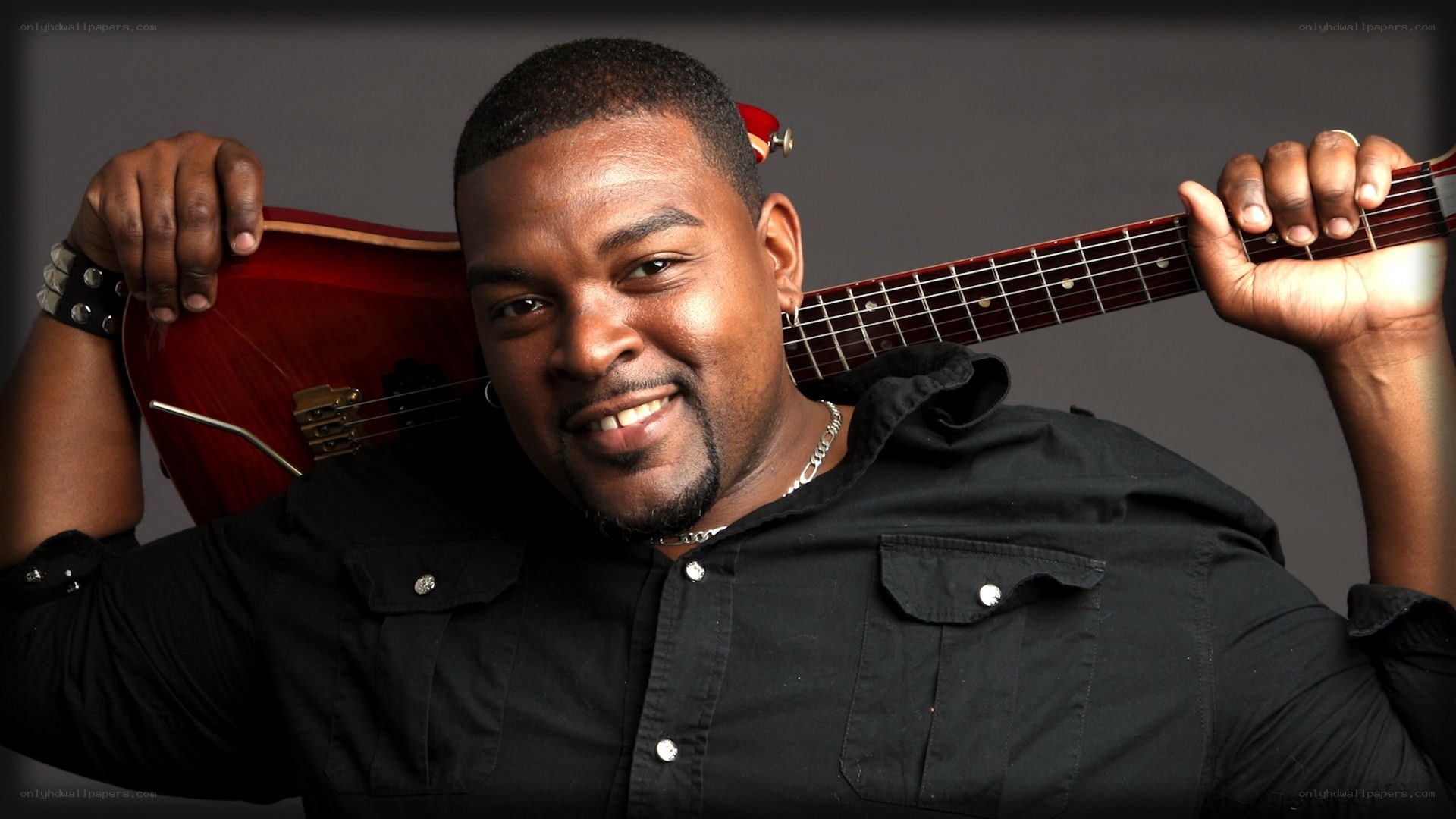 Musician with red bass guitar