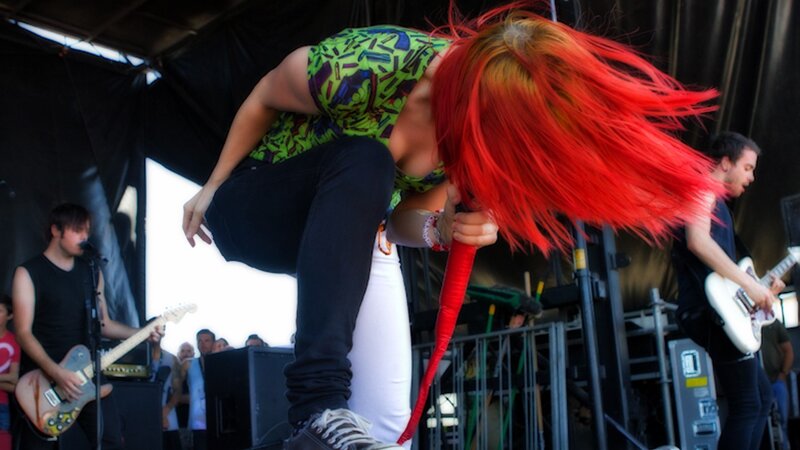 Musician with red hair performing