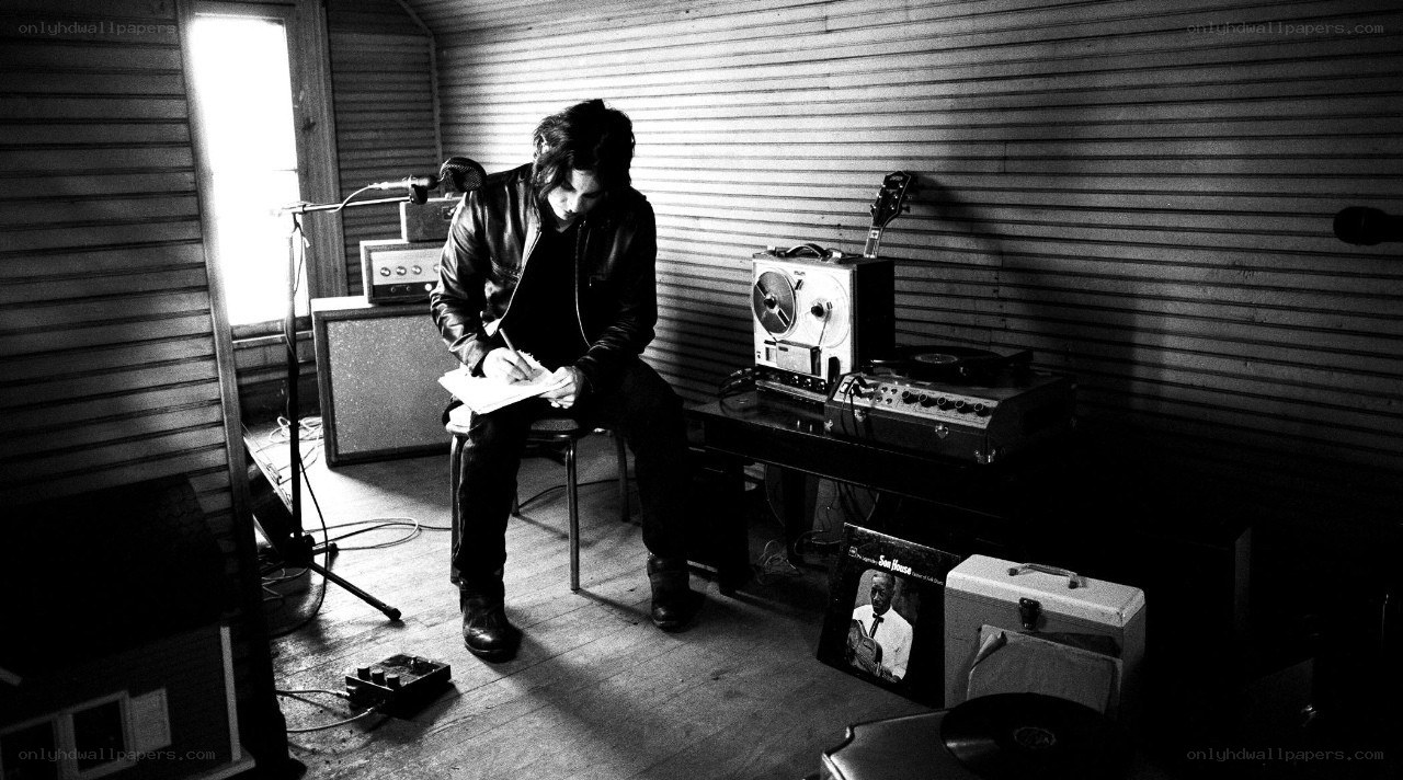 musician writing in studio