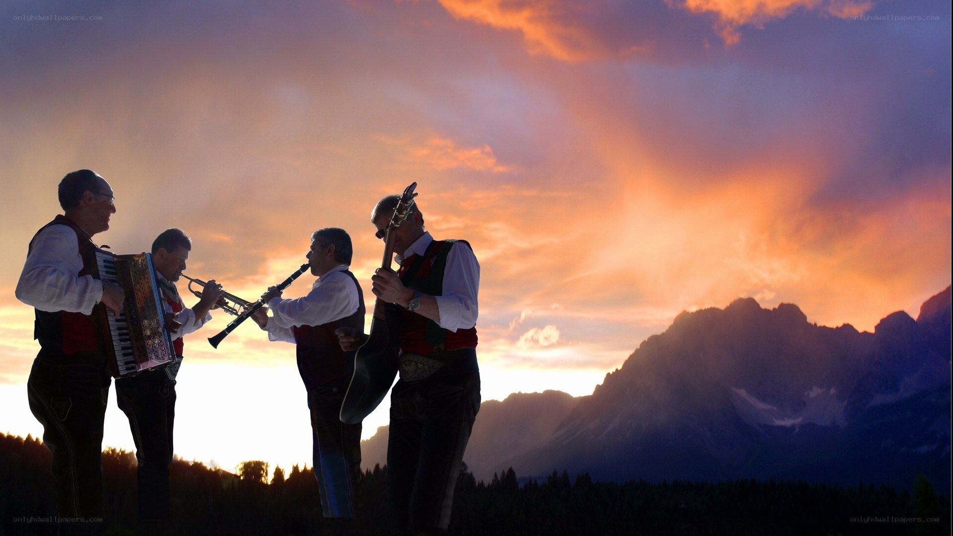 Musicians at sunset in the mountains