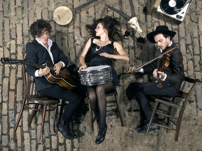 Musicians on a brick floor