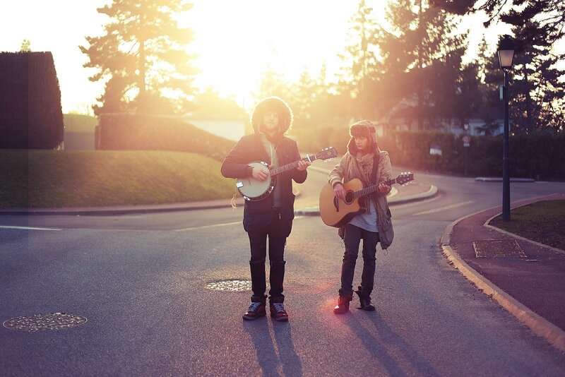 Musicians on a street at sunset