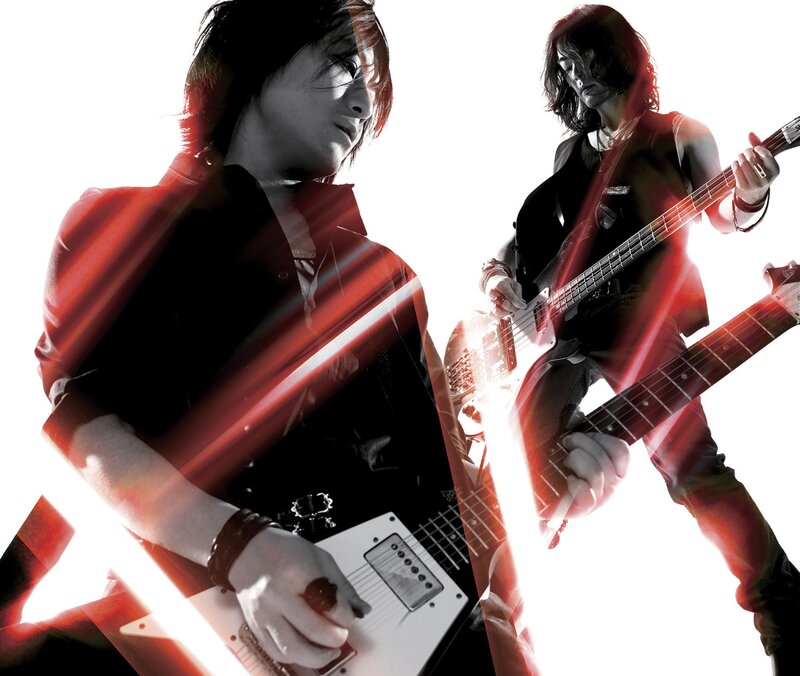 Musicians playing electric guitars