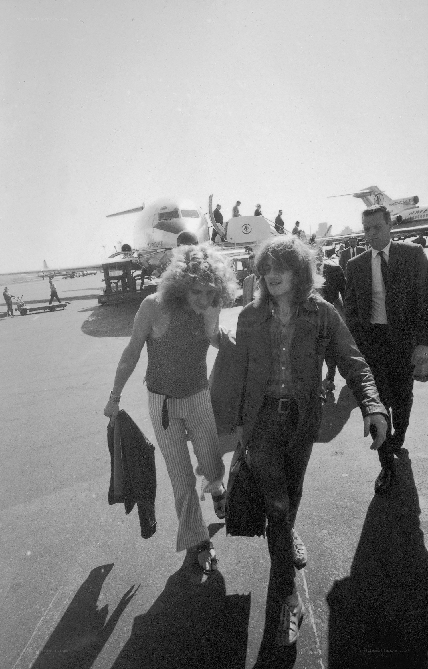 Musicians walking at airport
