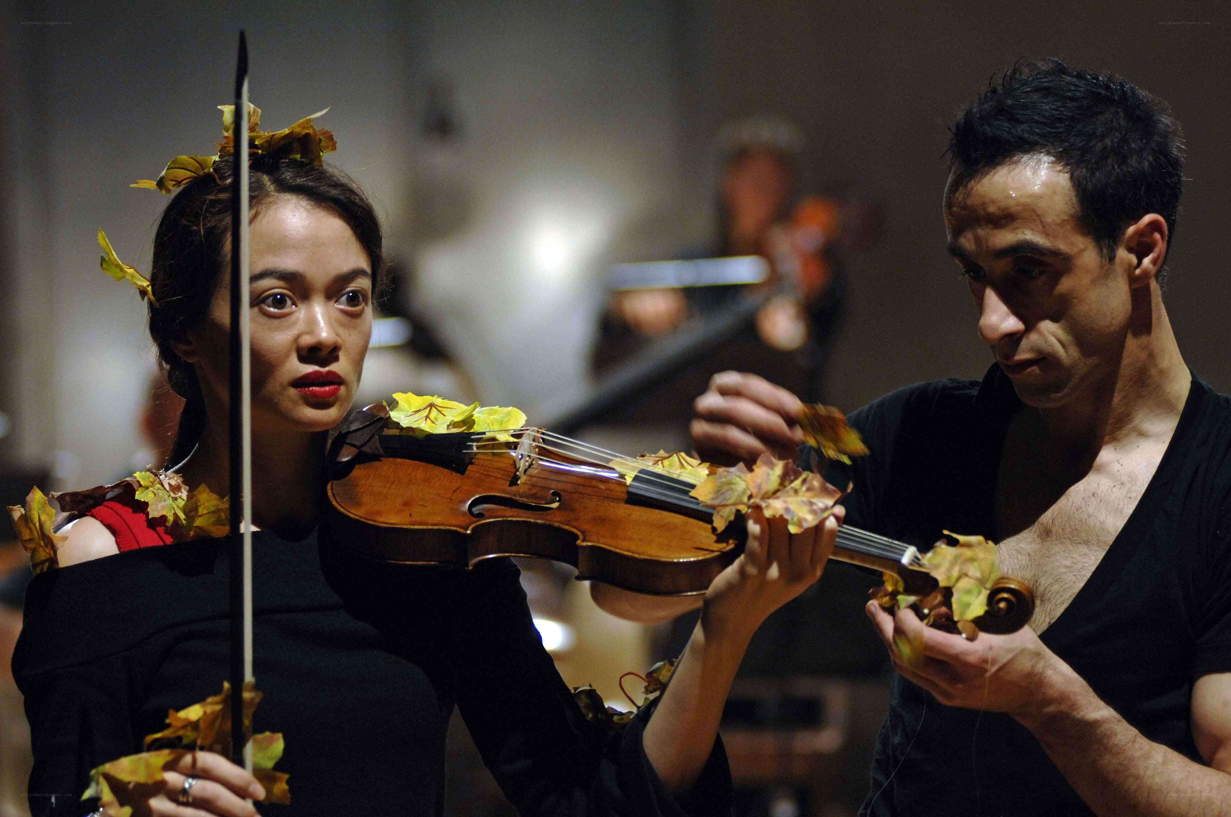 Musicians with leaf-decorated violins