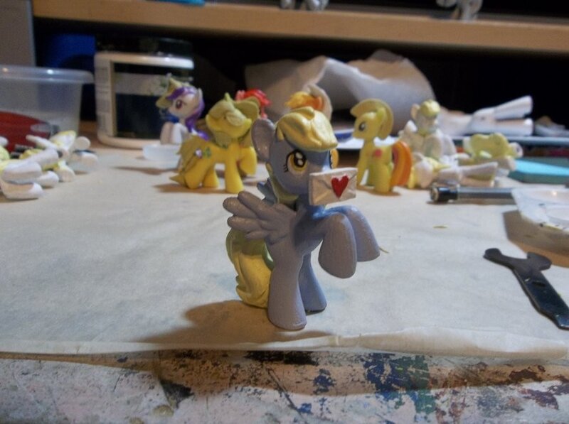 My Little Pony figurines on a workbench