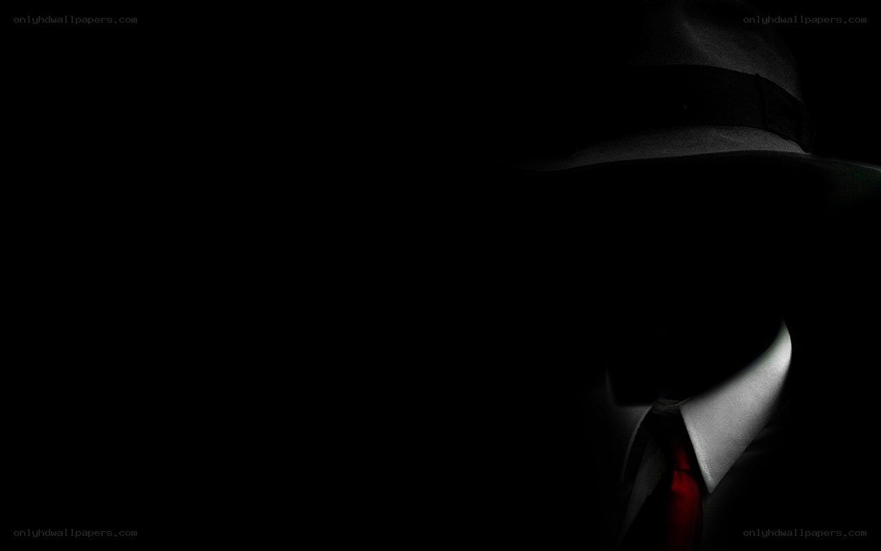 mysterious figure in hat