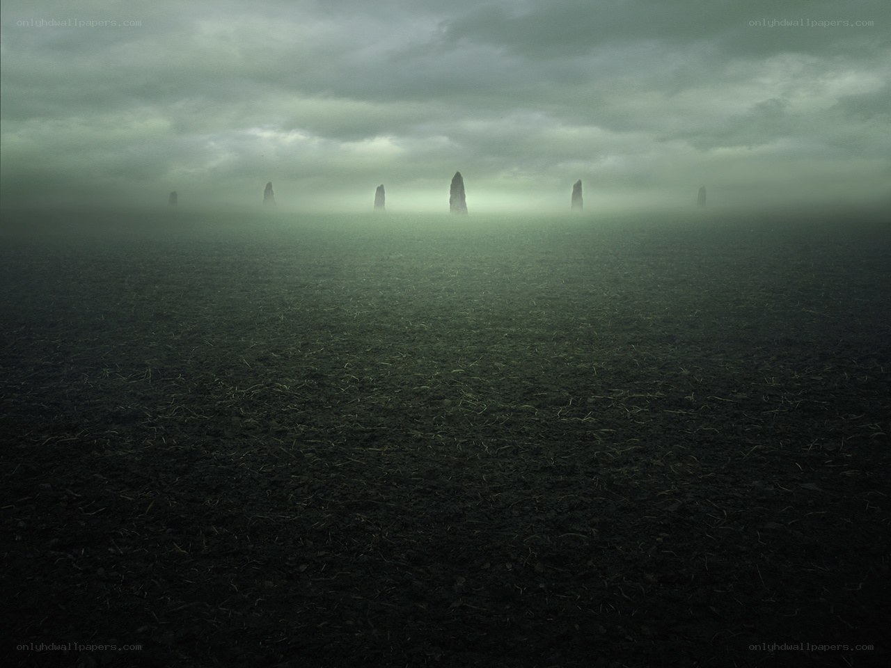Mysterious stone pillars in fog
