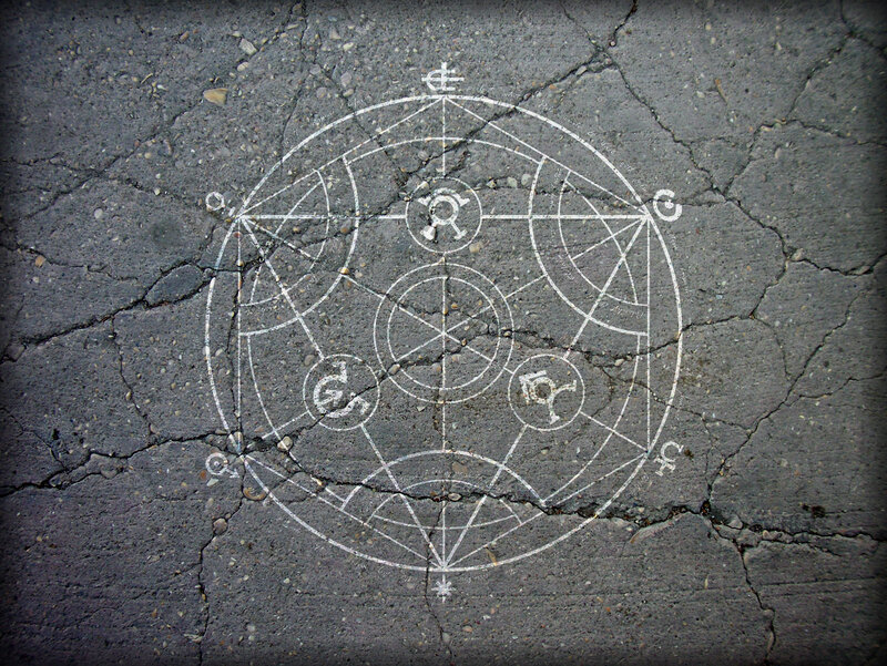 mystical symbol on cracked pavement