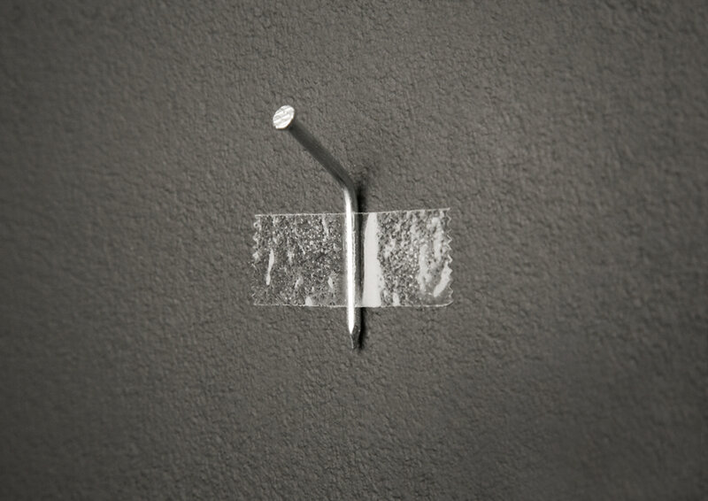 Nail taped to a wall