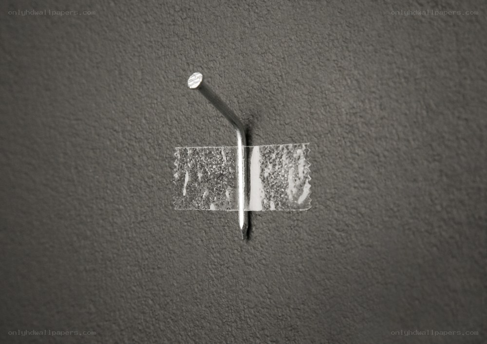 Nail taped to a wall