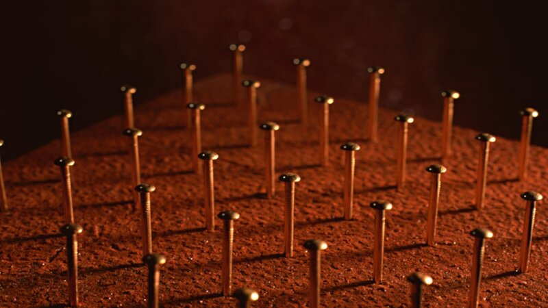 Nails on a wooden surface