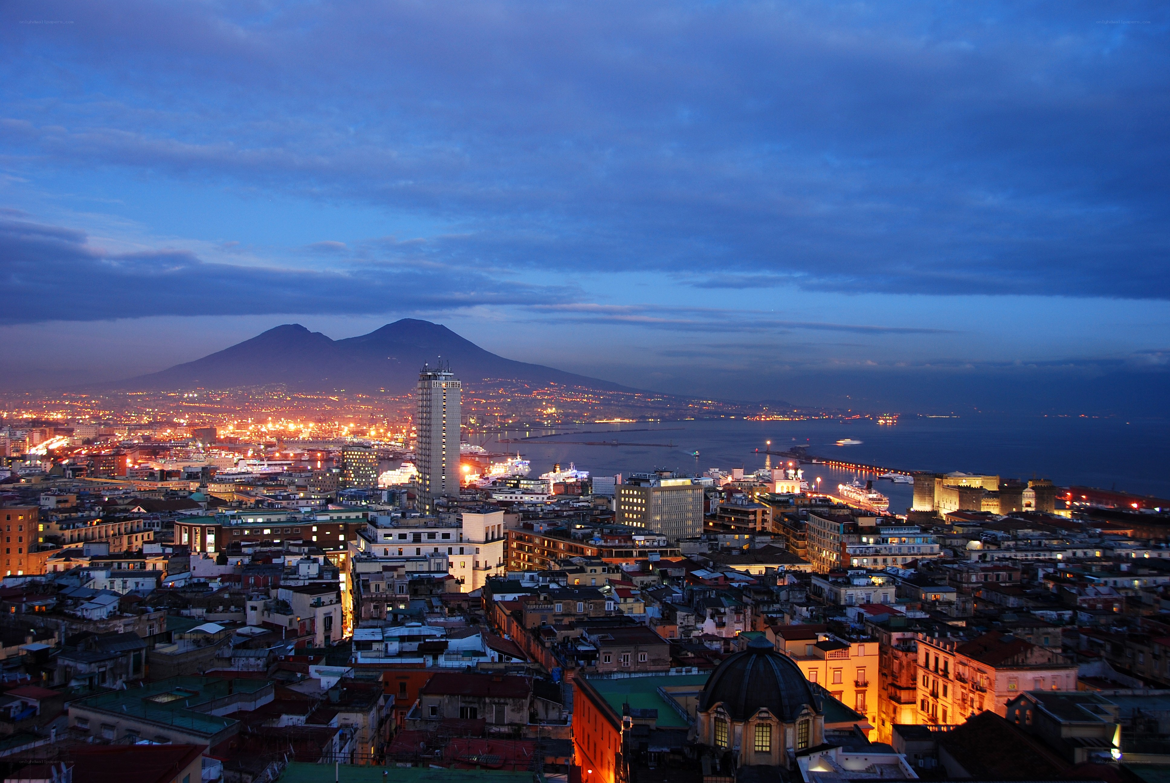 Naples at dusk with Vesuvius