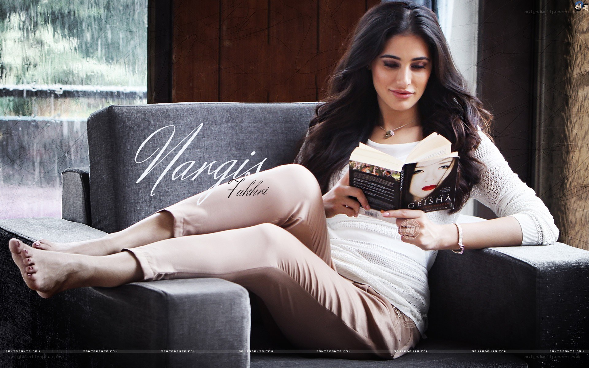 Nargis Fakhri reading a book