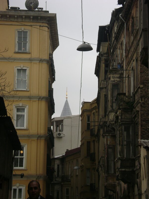 Narrow street with minaret view