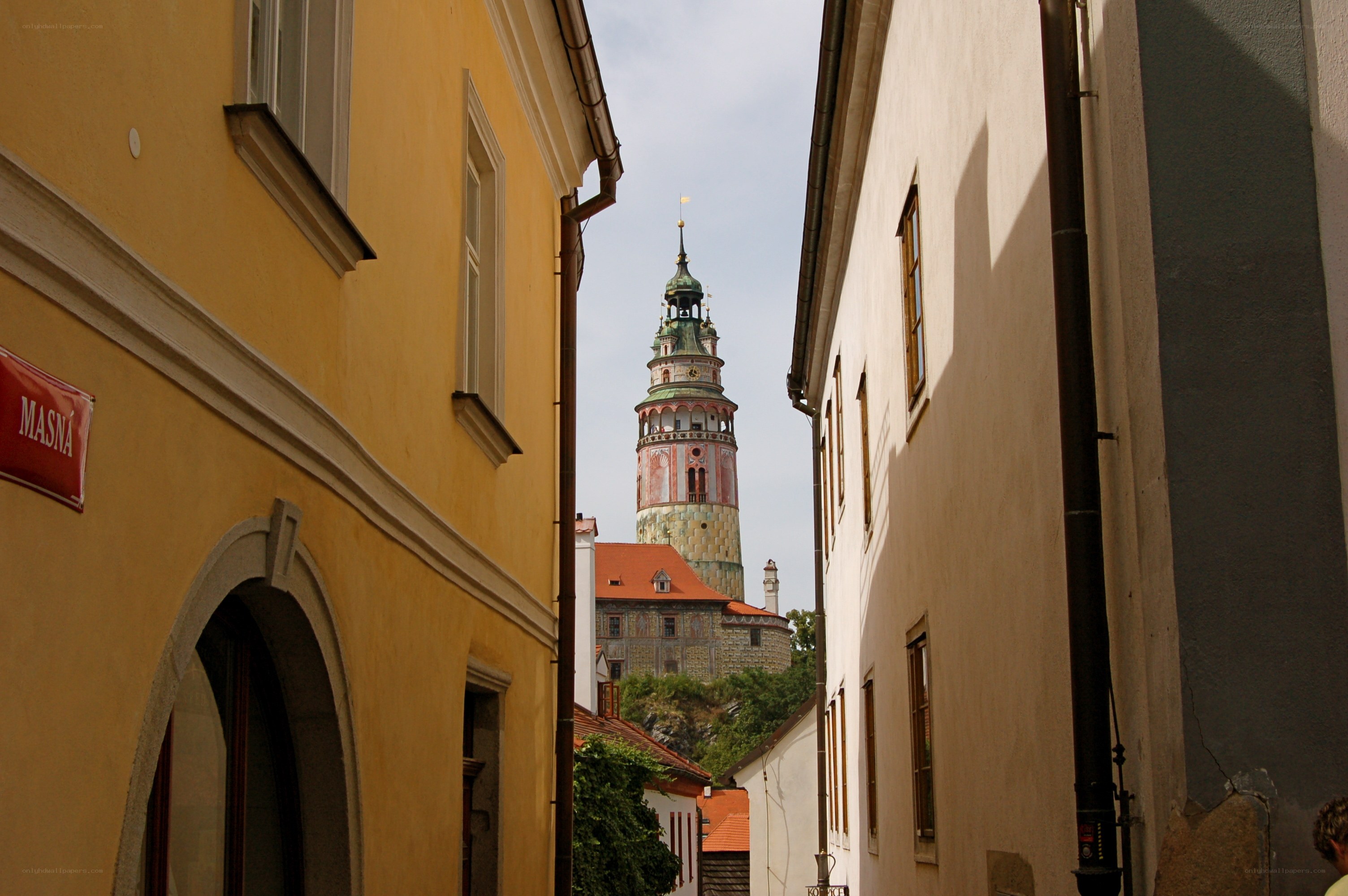 Narrow street with tower view