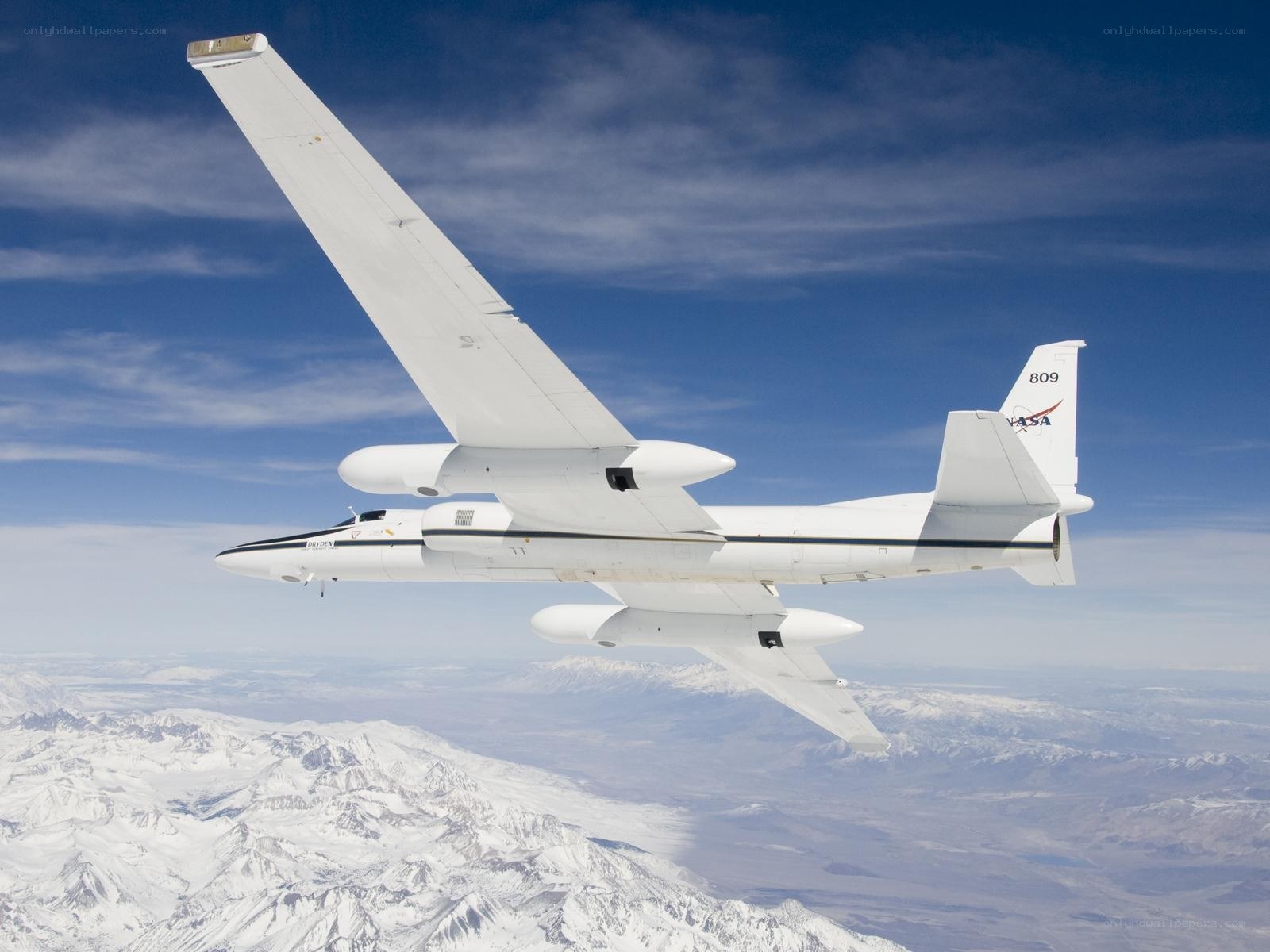 NASA aircraft over snowy mountains