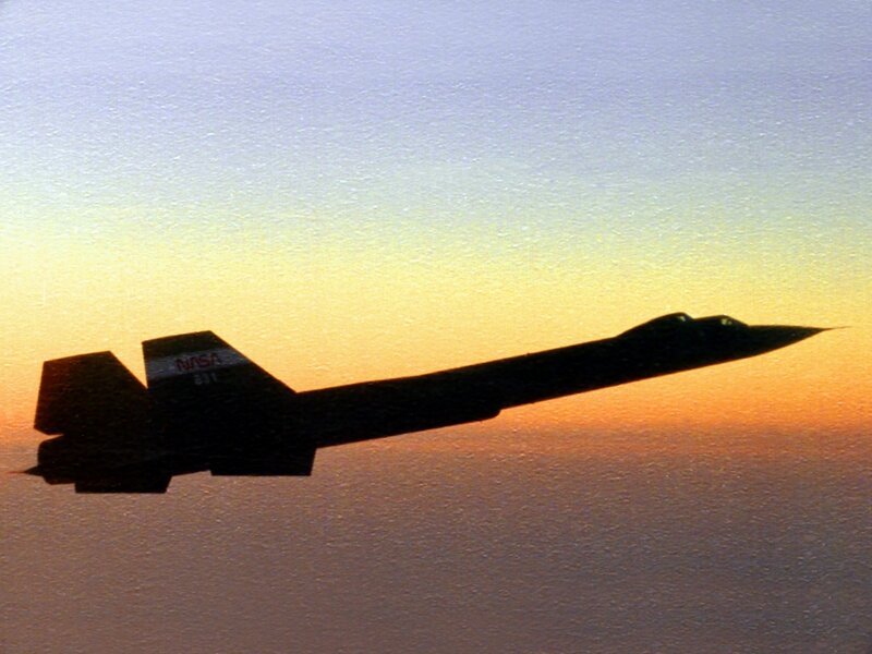 NASA aircraft silhouette at sunset