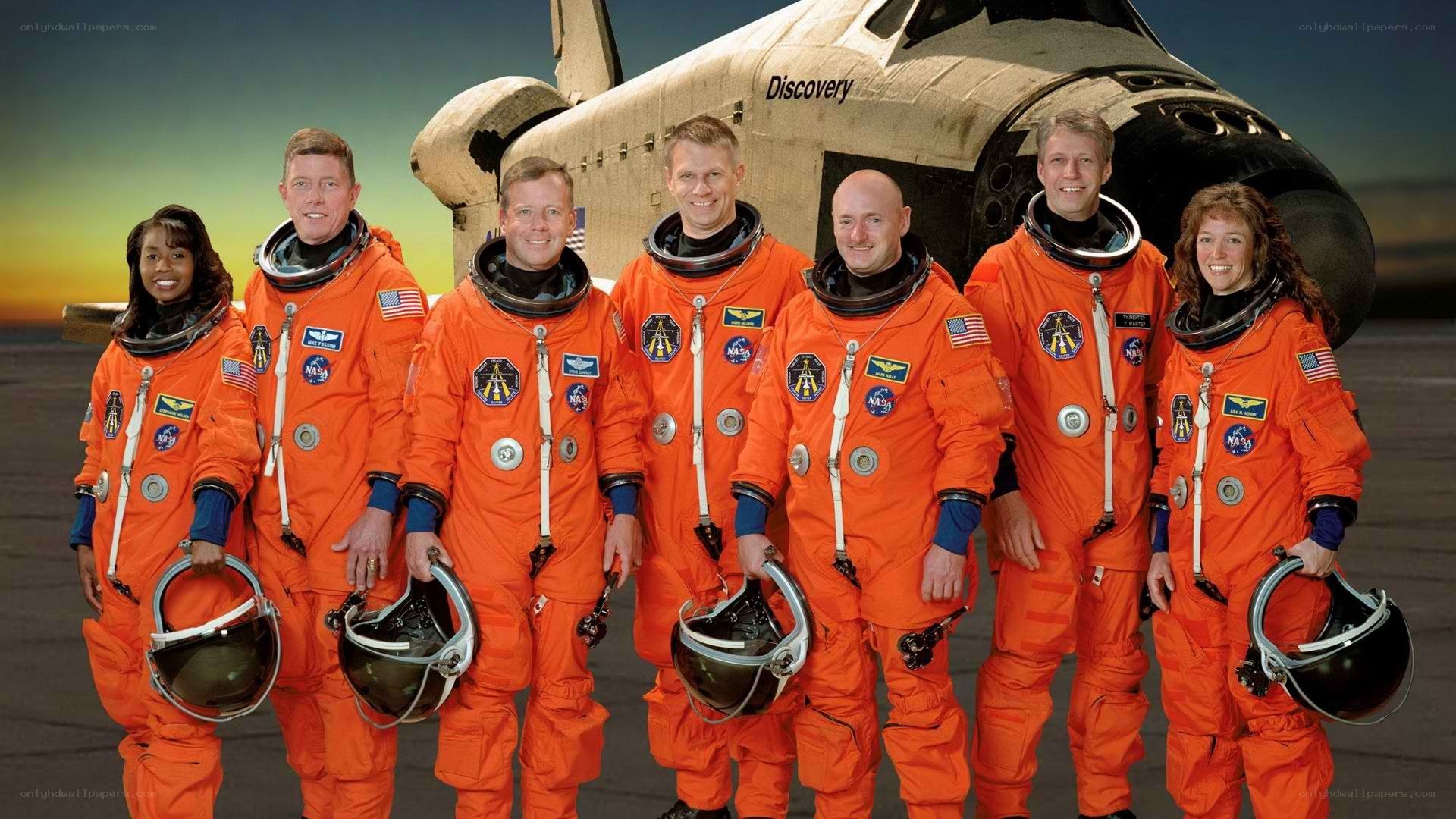 NASA astronauts with Discovery shuttle