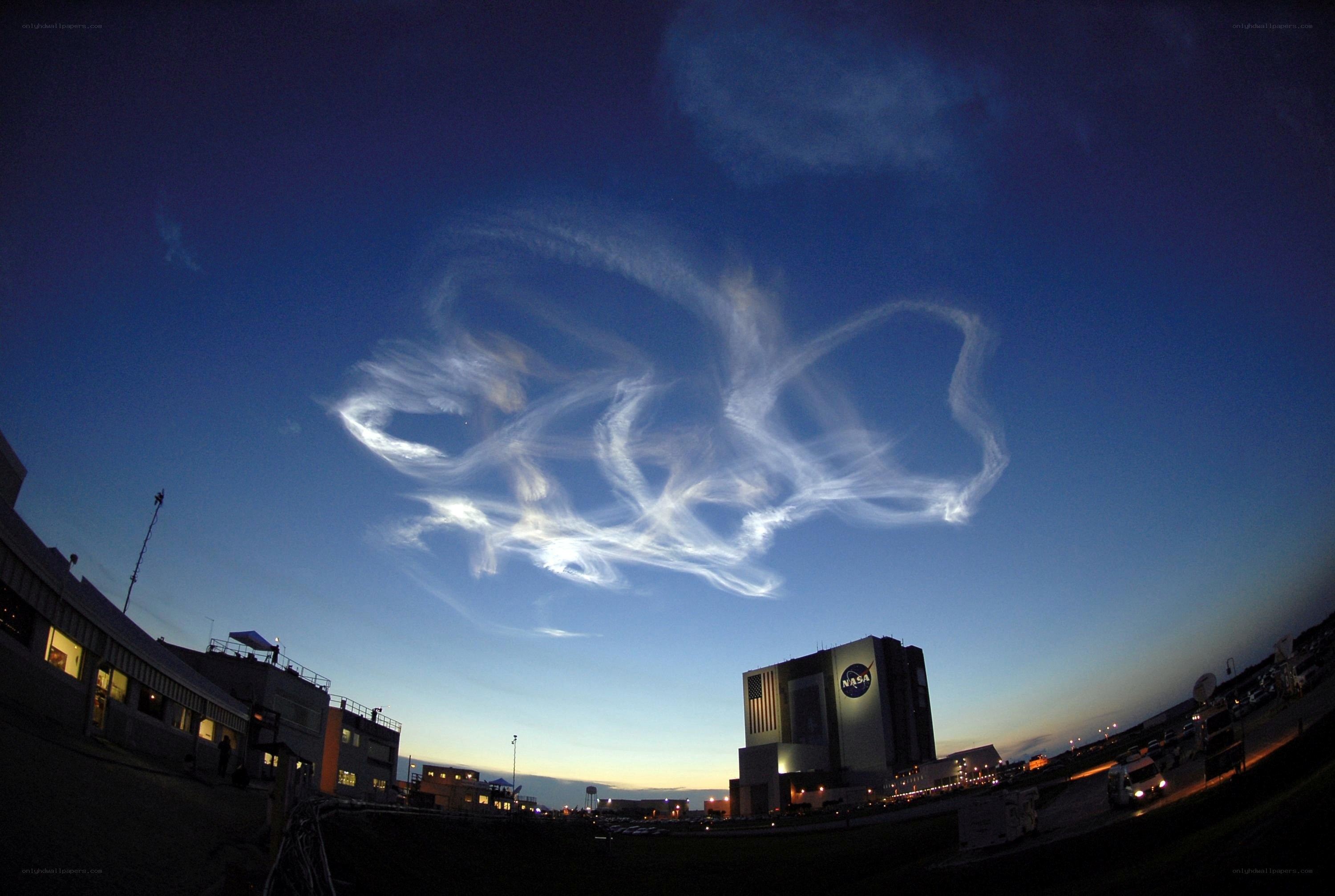 NASA building with contrails
